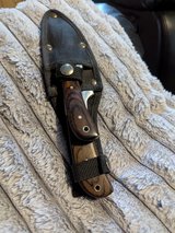 Pair of deer Damascus steel skinning knives in belt pouch in Lakenheath, UK