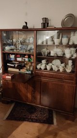 Two part walnut display cabinet in Ramstein, Germany