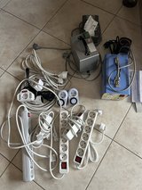 Box of 220V Extension and Strip Outlet Cords, Indoor Timers and Transformers in Ramstein, Germany