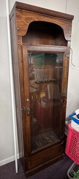 wooden gun cabinet with single door in Fort Polk, Louisiana