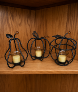 3 Metal Pumpkin Candle Holders with Candles in Alamogordo, New Mexico