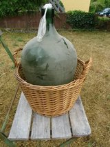big old bottle wickerbasket - for fruit-wine in Ramstein, Germany