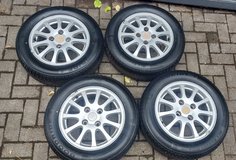 4 x Mitsubishi all season tires on alloy wheels like new 195/60 R15  BP 4*114,3 mm in Ramstein, Germany