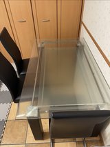 Glass top dining table with 4 chairs in Okinawa, Japan