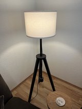 Dark wood tripod lamp in Ramstein, Germany