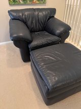 Blue leather chair with a matching ottoman in good condition. in Kingwood, Texas