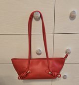 Red purse in Conroe, Texas