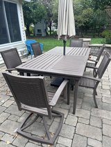 outdoor table with 2 swivel chairs and 4 arm chairs in Bolingbrook, Illinois