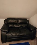 Brand new black leather love seat in Ramstein, Germany